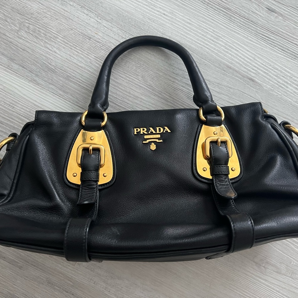 Prada black leather bag.